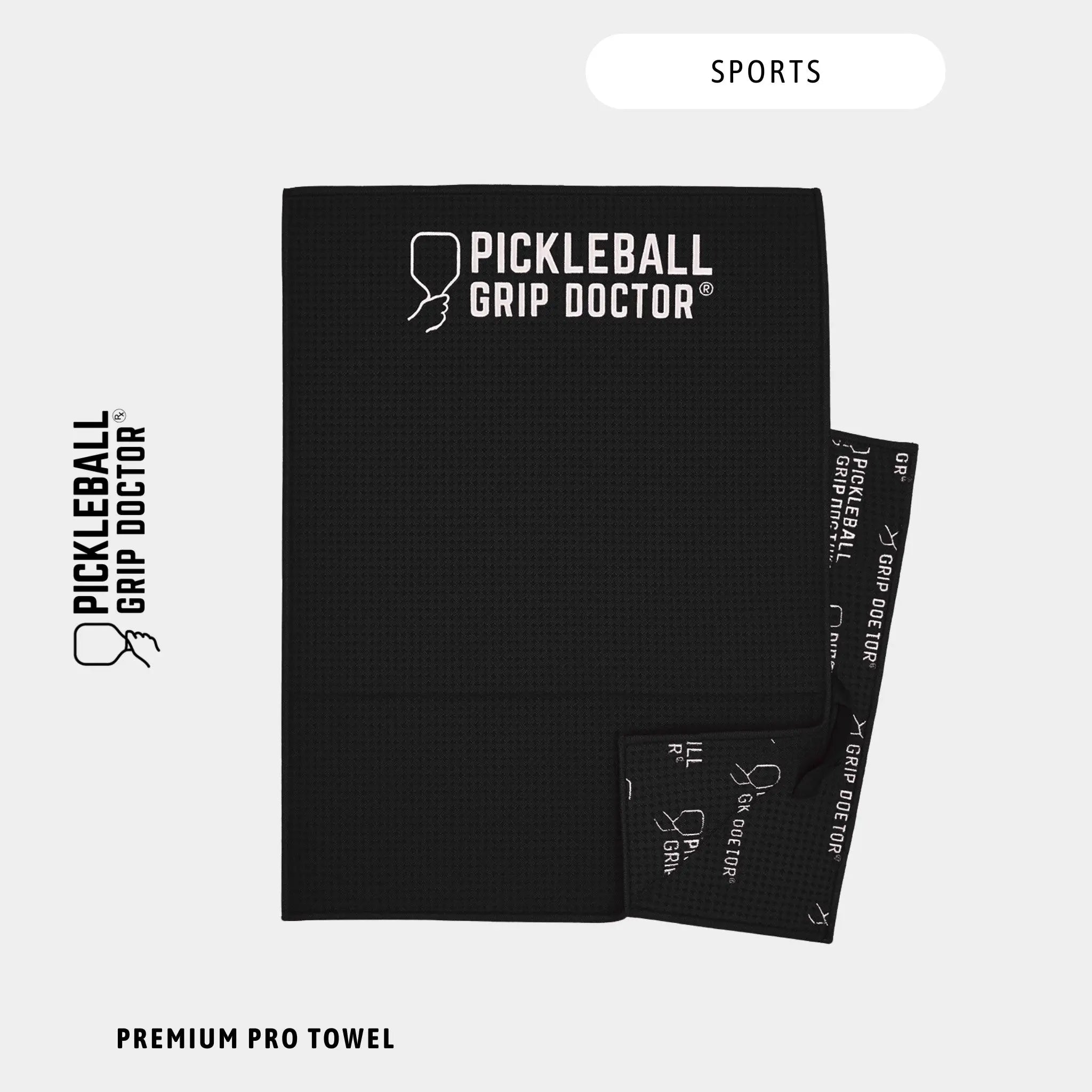 Black towel with 'Pickleball Grip Doctor' branding on a white background