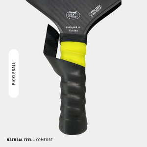 Close-up of a pickleball paddle with UEA branding on a white background