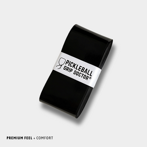 Black pickleball grip with 'Pickleball Grip Doctor' label on a light gray background