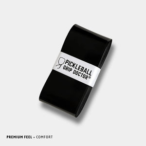Black pickleball grip with 'Pickleball Grip Doctor' label on a light gray background