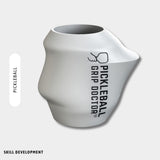 White pickleball grip device with 'Pickleball Grip Doctor' branding on a light gray background