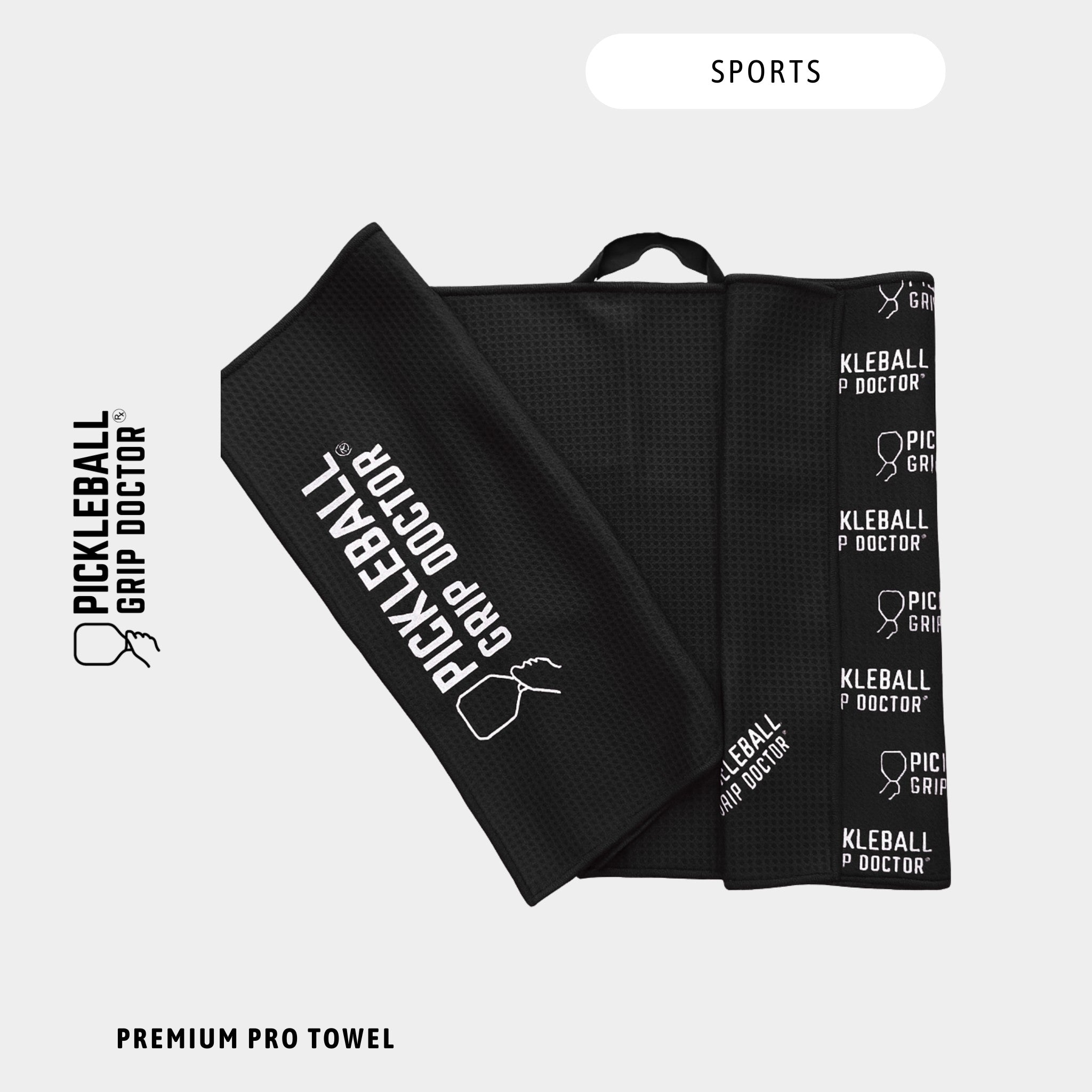 Black towel with 'Pickleball Grip Doctor' branding on a white background