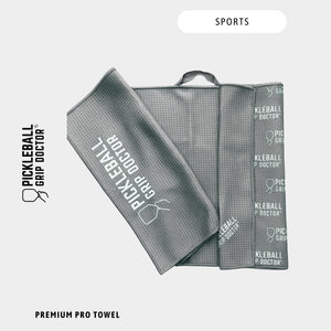Gray sports towel with 'Pickleball Grip Doctor' branding on a white background