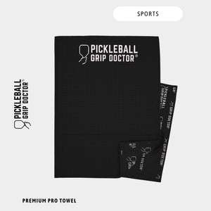 Black towel with 'Pickleball Grip Doctor' branding on a white background