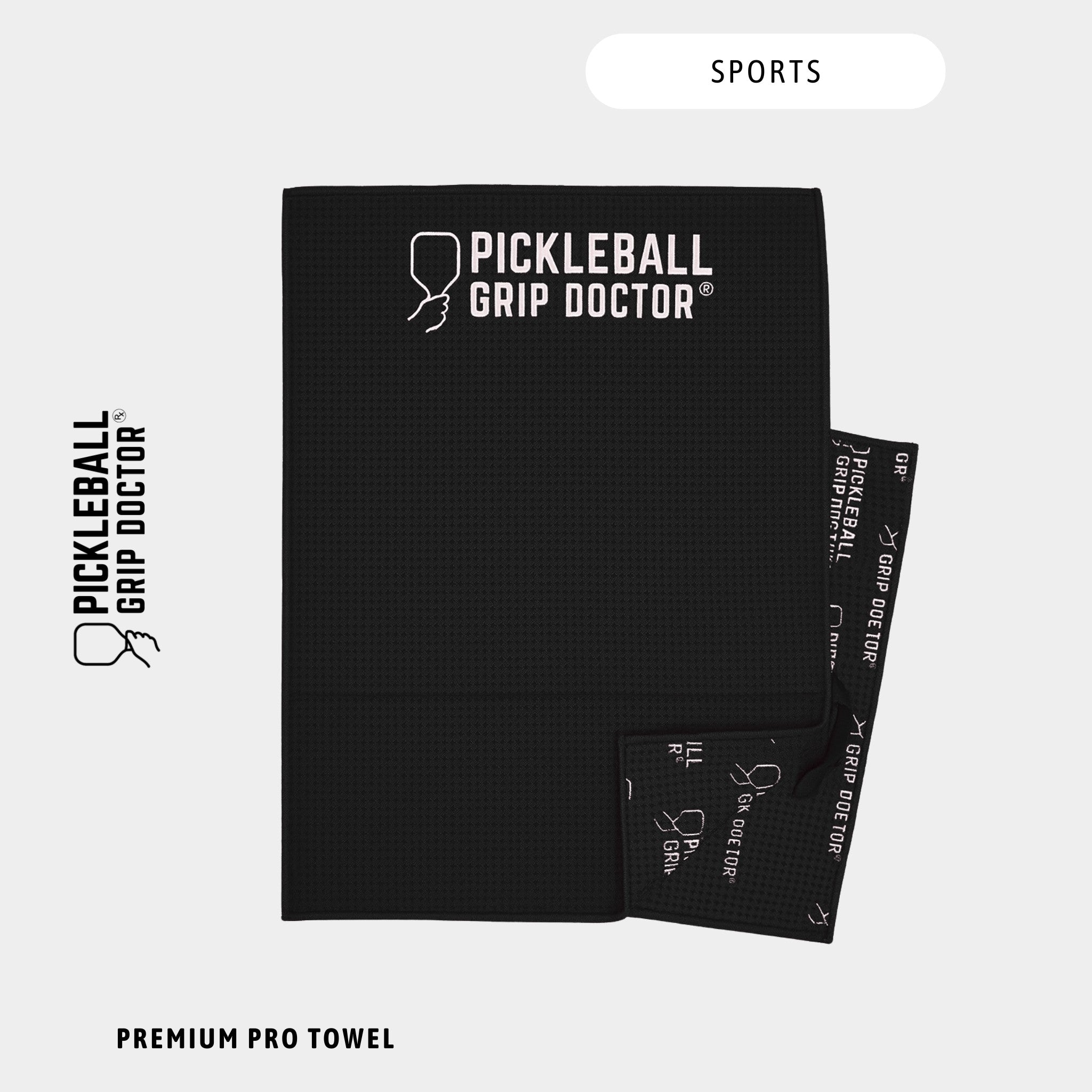 Black towel with 'Pickleball Grip Doctor' branding on a white background