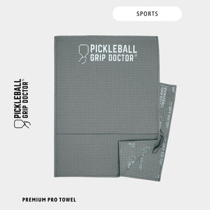 Gray towel with 'Pickleball Grip Doctor' branding on a white background