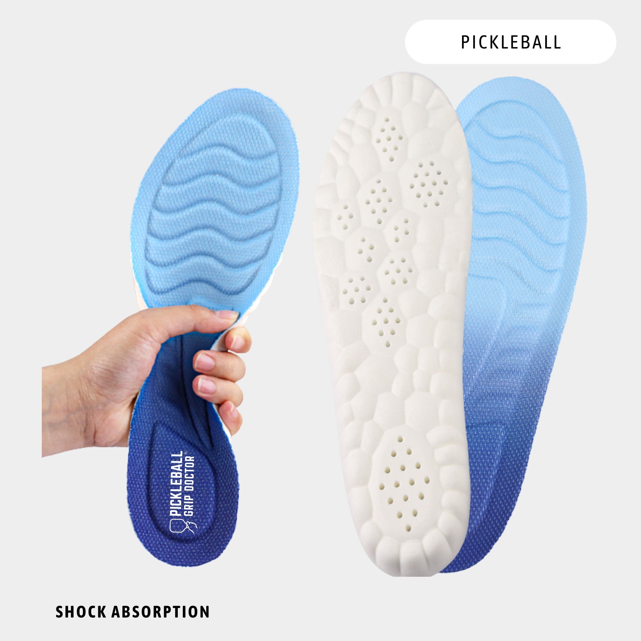 Blue and white pickleball shoe insole with shock absorption features, held by a hand.