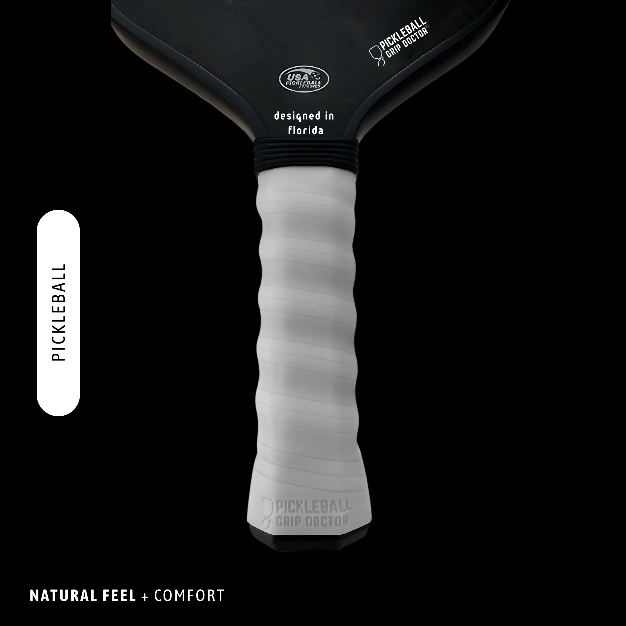 Pickleball paddle with black top and white handle on a black background